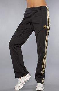 adidas The Firebird Track Pant in Black Gold