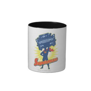 Superman lifts a car 2 coffee mugs