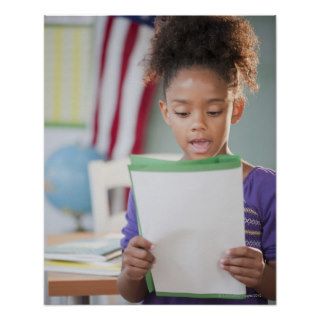 Mixed race girl reading report at school poster
