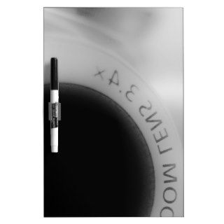 Black and white camera lens dry erase white board