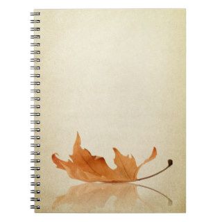 Autumn maple leaf on fabric texture spiral notebook