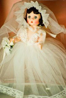 Madame Alexander   #435   Bride Doll   8 Inches   Brown Hair / Gray Sleepy Eyes   White Tulle Wedding Dress w/ Lace Trim   Floral Bouquet w/ Ribbon   Veil Cap   Lace V Bodice   Lace Trimmed Bloomers   Flowered Garter   White Shoes   Out of Production   Lik