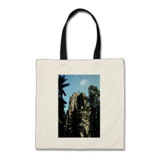 Climber jumping one rock top to another, Czec Tote Bags