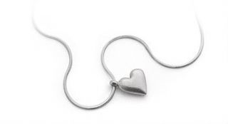 silver heart necklace and chocolate by the heart store
