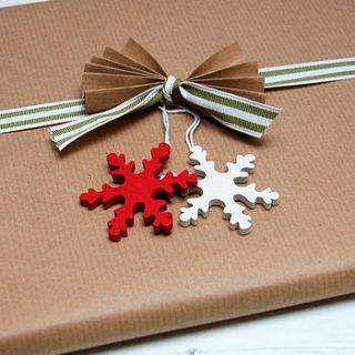 two wooden snowflakes red and white by spotty n stripy