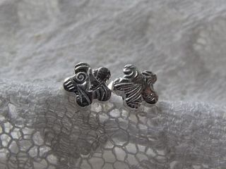 small silver textured flower studs by lucy kemp jewellery