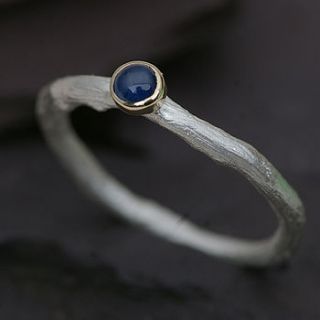 sapphire ring in silver with a gold setting by anthony blakeney