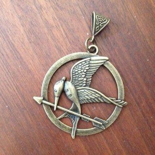 The Hunger Games Movie Mockingjay Pendant on Leather Cord Toys & Games