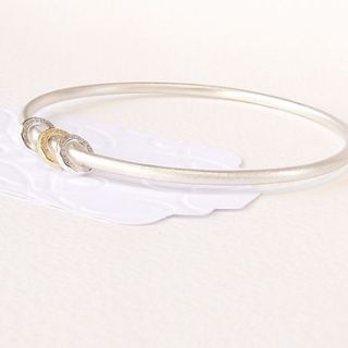 silver and 18 carat gold spinner bangle by silversynergy