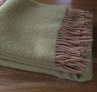 green and taupe throw by velvet brown