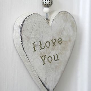 wooden 'i love you' hanging heart by red berry apple