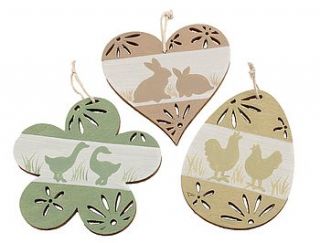 set of twelve wooden easter decorations by the contemporary home