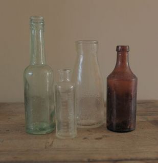 four vintage bottles by homestead store