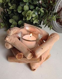 small circular driftwood candle holder by the hiding place