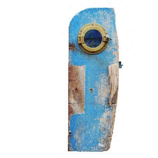 blue porthole cabinet by nautilus driftwood design