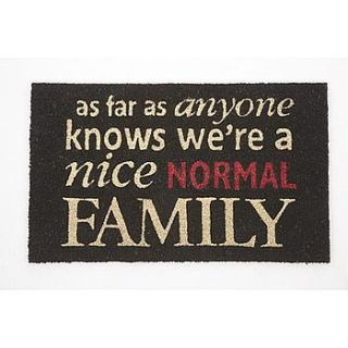 'we're a nice normal family' door mat by hope and willow