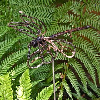 recycled dragonfly on stem garden decoration by london garden trading