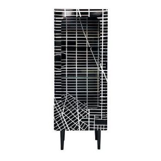 grid design cabinet with glass door by out there interiors