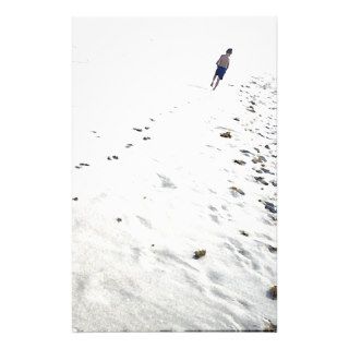 Footprints of boy walking in the sand stationery