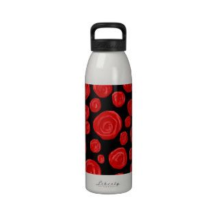 Romantic red roses on black background. water bottles