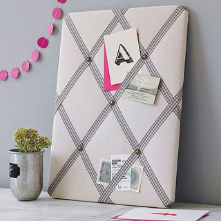 cream linen noticeboard by pins and ribbons