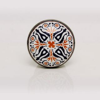 round ceramic tangier knob in white, orange and black by trinca ferro