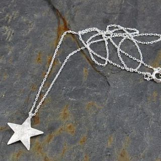 'bright star' silver or gold star necklace by nest