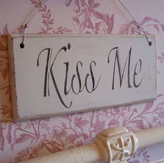 antique style 'kiss me' plaque by the painted broom company