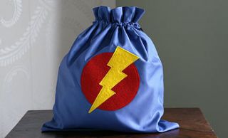 a super hero drawstring bag by red berry apple