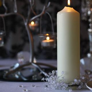 white candle ring with hearts beads and bells by the wedding of my dreams