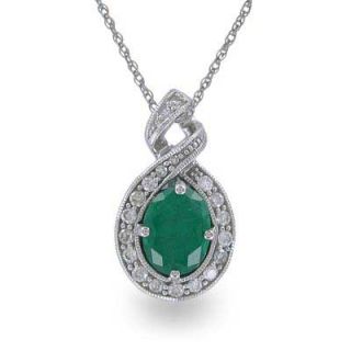 Oval Lab Created Emerald and 1/4 CT. T.W. Diamond Twist Pendant in 14K