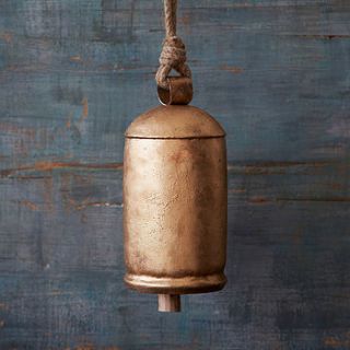 large gold iron hanging bell by paper high