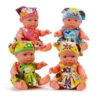 BABY DOLL WITH FLOWERED DRESS. Includes matching headscarf. Assorted colors   color sent at random   Size 9 " Sitting 7" 