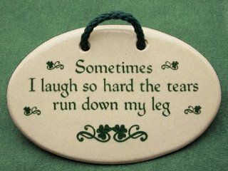 Sometimes I laugh so hard the tears run down my leg. Mountain Meadows Pottery ceramic plaques and wall art signs with funny sayings and quotes about laughter, aging, and peeing in your pants, or wetting your pants when sneezing, with an Irish decoration. M