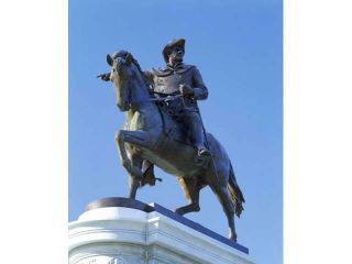 Statue of Sam Houston pointing towards San Jacinto battlefield against blue sky, Hermann Park, Houston, Texas, USA Print